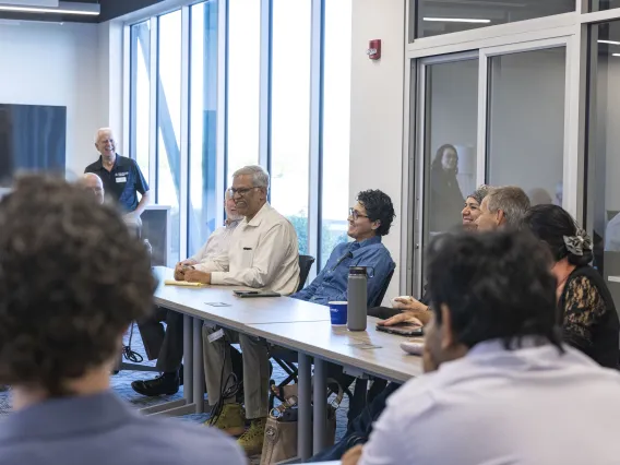 Inventor Vijay Gokhale of the BIO5 Institute participates in the discussion.