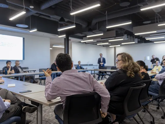 Asking questions of Interim Director of the Silicon Valley US Patent and Trademark Office during a group discussion.