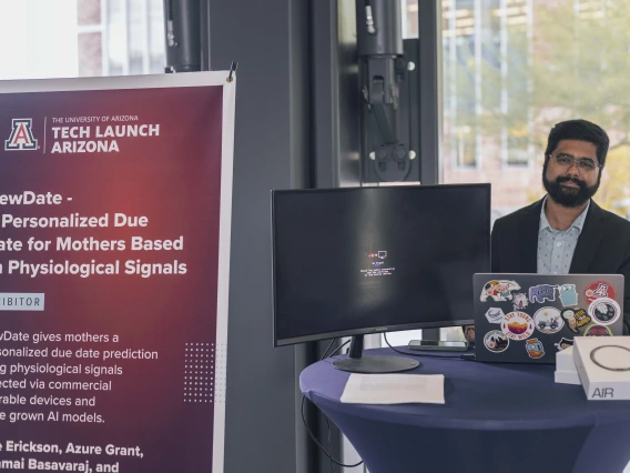 A man at a table at the 2024 I Squared Awards