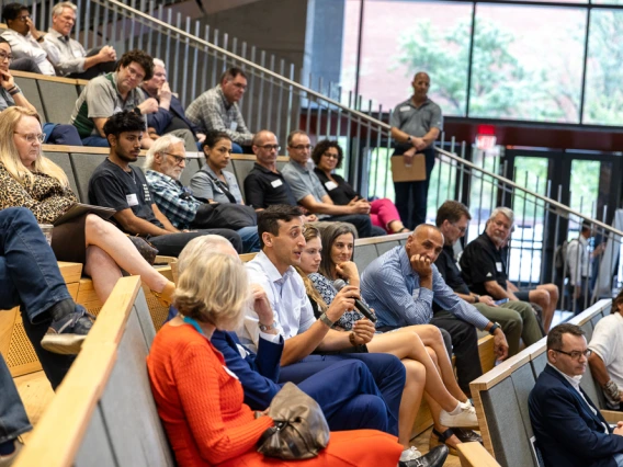 The crowd particpates in the discussion at the fireside chat.