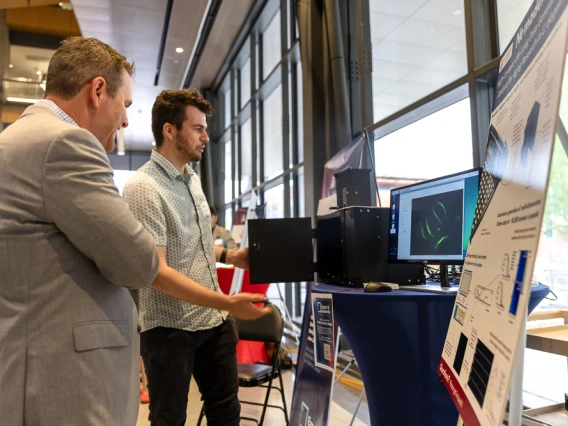 Attendees peruse expo tables at I-Squared 2025.