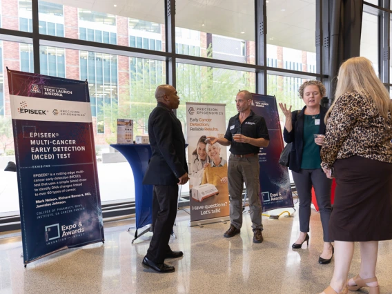 Attendees peruse expo tables at I-Squared 2025.