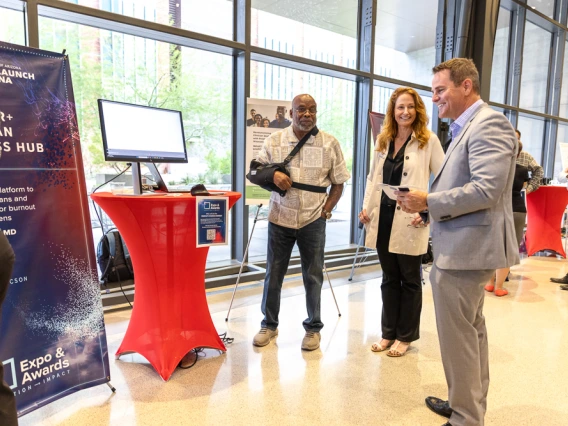 The Lifespan Digital Health team meets with visitors at their expo table. 
