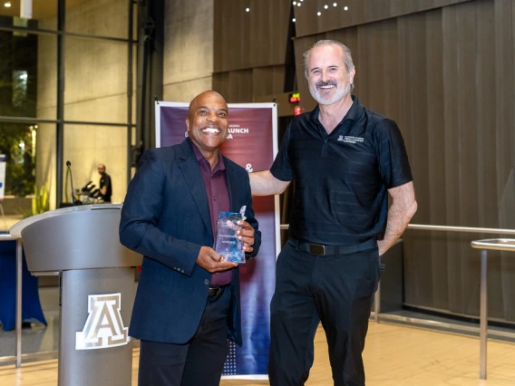 Doug Hockstad presents the Startup of the Year award to Mark Nelson of Precision Epigenomics.