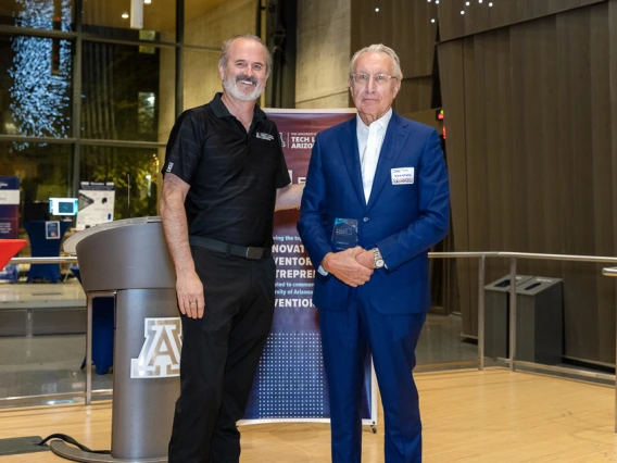 Doug Hockstad presents the Ecosystem Impact award to Jim Laugharn.