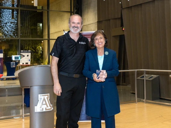 Doug Hockstad presents the Inventor of the Year award to Roberta Diaz Brinton.
