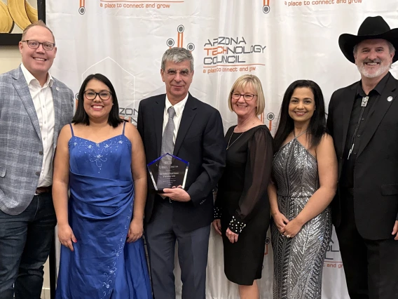 The NewFoS and TLA teams pose together at the event. 