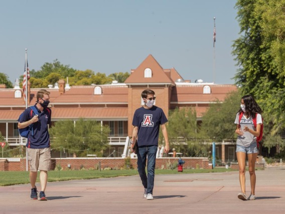 students in masks on campus