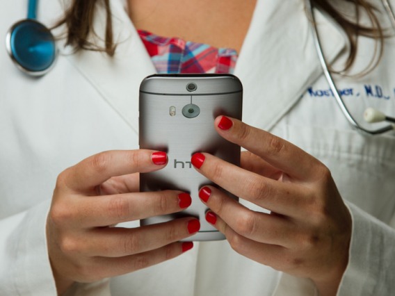 doctor using smartphone image