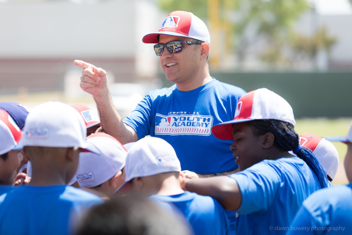Ricardo Valerdi on the baseball field with students.