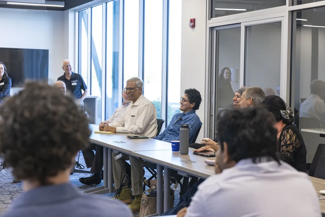 Inventor Vijay Gokhale of the BIO5 Institute participates in the discussion.