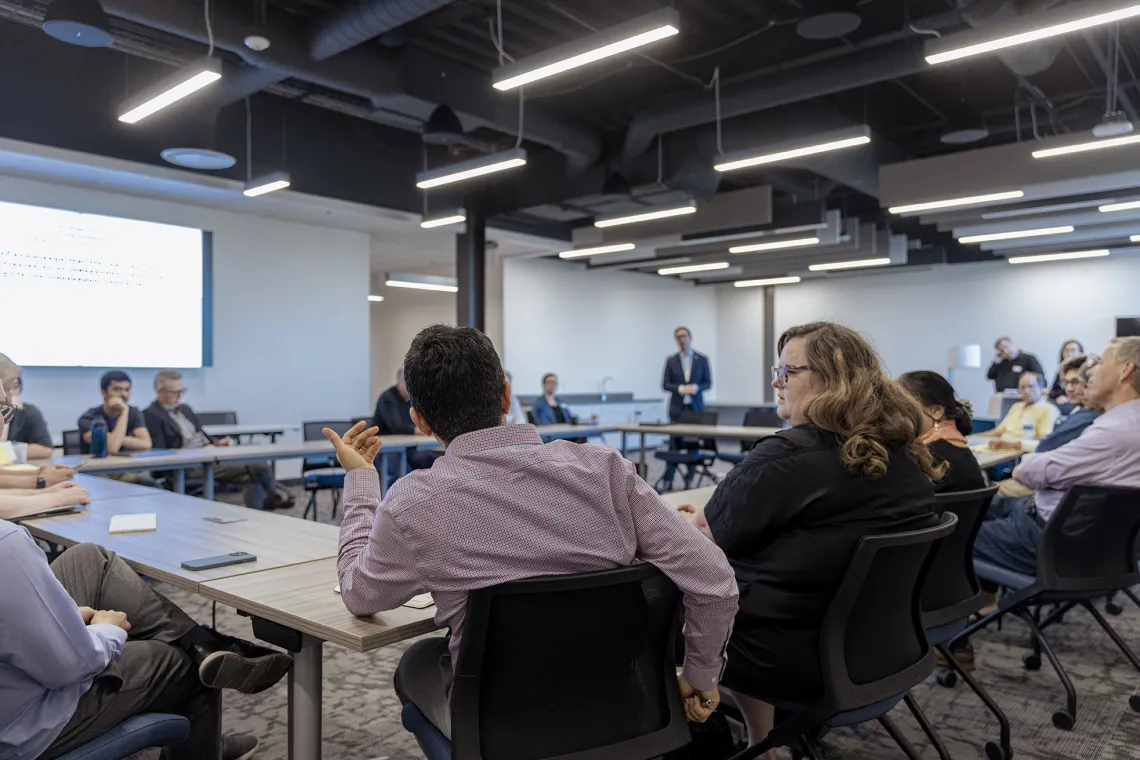 Asking questions of Interim Director of the Silicon Valley US Patent and Trademark Office during a group discussion.