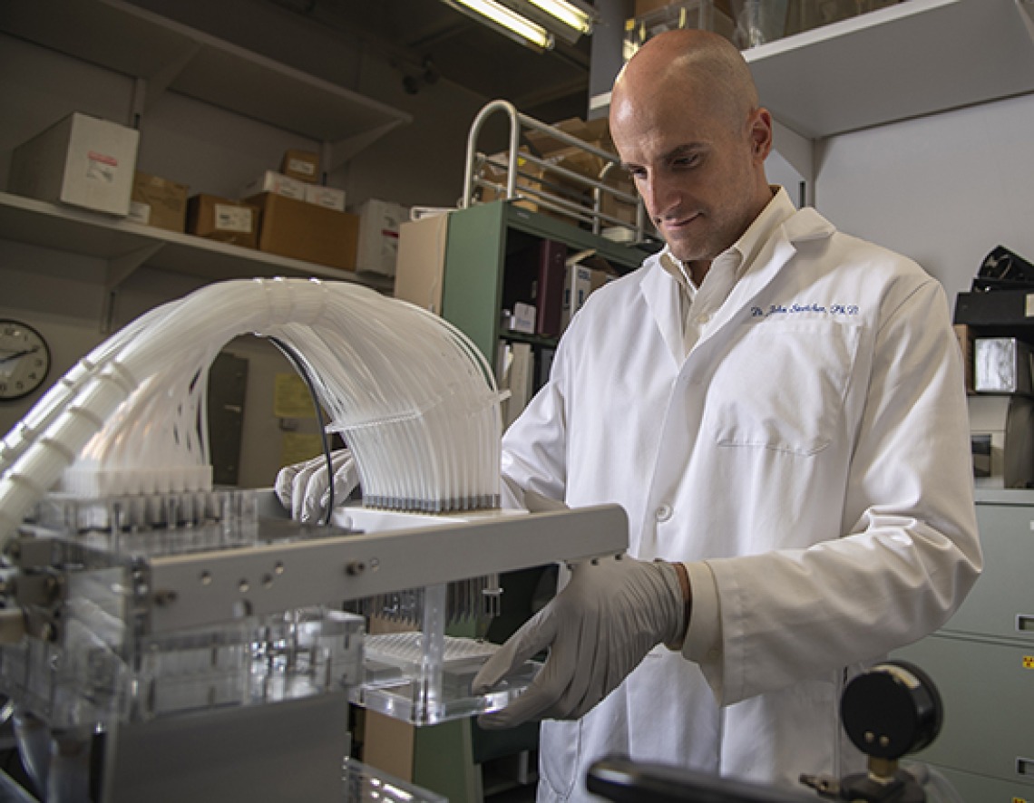 An image of John Streicher in the lab.