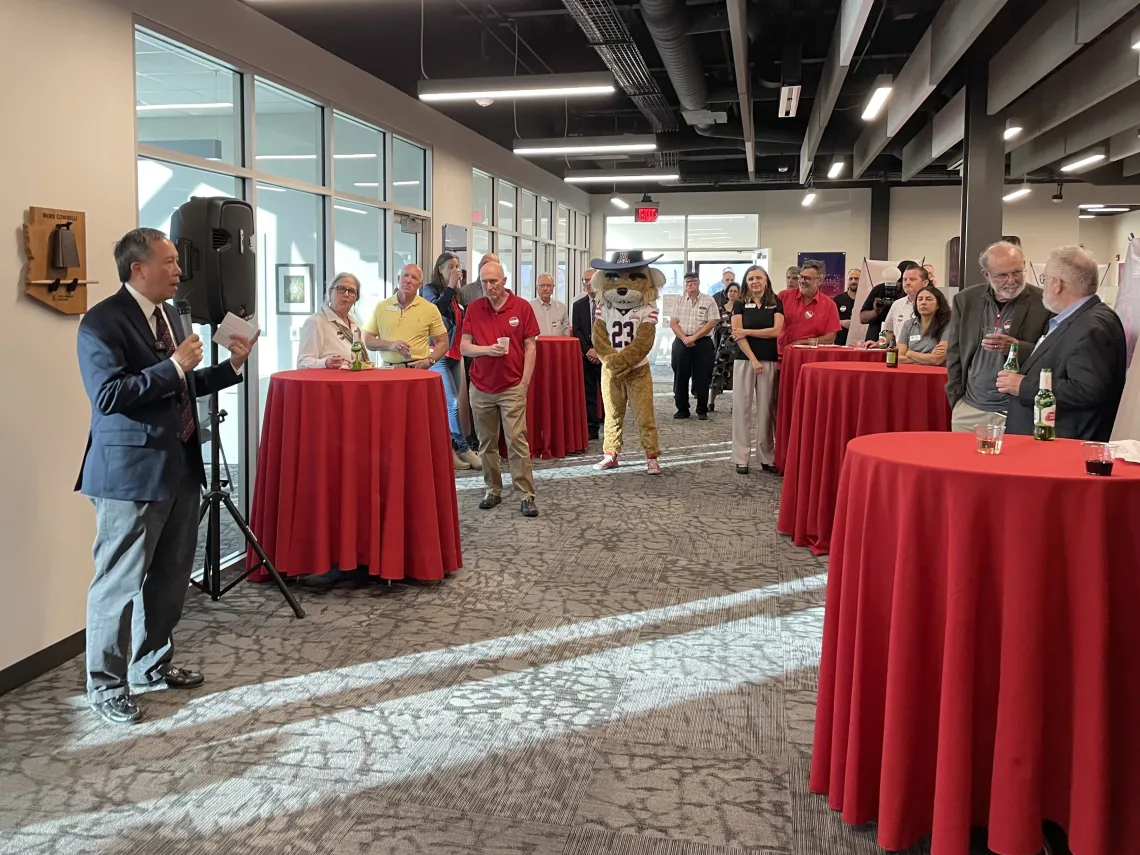 Elliott Cheu addresses attendees at the celebration. 