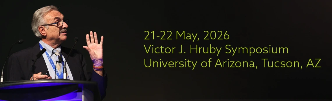 Victor Hruby talking at a podium with text on the image that reads, "21-22 May, 2026. Victor J. Hruby Symposium. University. of Arizona, Tucson, AZ."