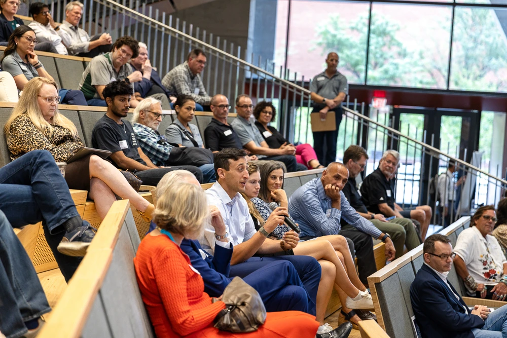 The crowd particpates in the discussion at the fireside chat.