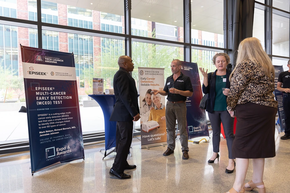 Attendees peruse expo tables at I-Squared 2025.