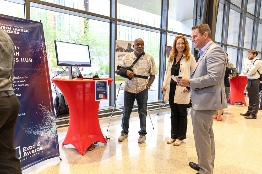 The Lifespan Digital Health team meets with visitors at their expo table. 