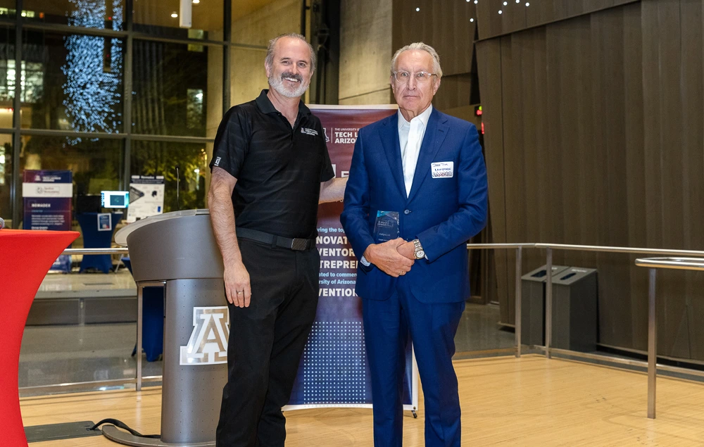 Doug Hockstad presents the Ecosystem Impact award to Jim Laugharn.