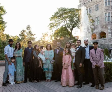 Tariq Ahmed at a wedding with his three siblings, wife Ruby, and his parents and their grandchildren. 