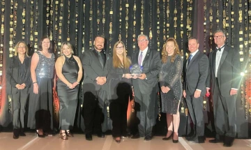 The Tech Parks Arizona team receiving the Ed Denison Business Leader of the Year award at GCOI.