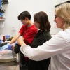 Jennifer Barton (right) works with two high-school students from the KEYS program in the lab.